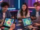 Engaged players enjoying Card Rummy on devices at https://cardrummyapp.com.pk/, showcasing vibrant graphics and excitement.