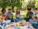 Friends enjoying the mobile game Teen Patti Gold in the park, highlighting community and fun.