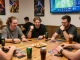 Exciting gaming scene showcasing sunwin card players in vibrant lounge atmosphere.