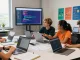 Students collaboratively coding and engaged in a technology workshop, showcasing the slot for creativity and learning.